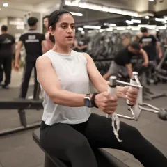 This is the focus and determination you'll find on our gym floor. Our members are committed to their goals, and we provide the premium equipment, like this seated row machine, to help them get there.