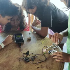 Using a field microscope, the children get a closer look at the tiny organisms that make up the coastal ecosystem. A single drop of seawater is an entire world, and with the right tools, we can begin to understand its complexity and beauty.