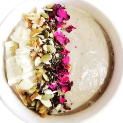 My Chickoo Smoothie is a wonderfully filling breakfast. I blend chickoo with dates and coconut milk, then top it with fresh fruits, nuts, and super seeds for a complete meal.