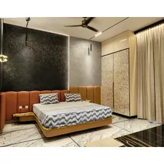 A wider view of the bedroom, showing the custom wardrobe with a unique textured finish that adds another layer of luxury.
