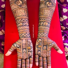 The full two-hand view of the previous design, showcasing the symmetrical placement of elephants, lotuses, and peacocks. The dense pattern work is perfect for a traditional bride.