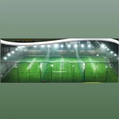 My sports grounds are ready for play day or night. This panoramic shot shows a fully lit multi-pitch facility, demonstrating how my turf provides a consistent, vibrant green surface under powerful floodlights.