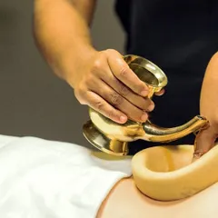 This is Kati Basti, one of our most effective treatments for chronic back pain and sciatica. A dam of herbal dough holds warm, medicated oil over the lower back, deeply nourishing the nerves and relieving stiffness.