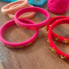 A glimpse of my work-in-progress materials. You can see colorful fabric components, beads, threads, and hand-painted pieces all waiting to be turned into beautiful jewelry.