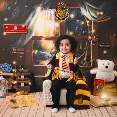 Looking every bit the part, this little wizard is ready for his journey to Hogwarts in this magical themed photoshoot.