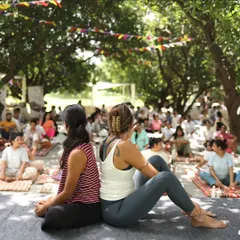 Back-to-back with a fellow yogi at Zenfest. Partner yoga isn't just about lifting each other up; it's also about grounding and supporting each other.