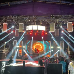 Owning a massive stage setup. I am experienced in performing at large scale outdoor events with complex sound and light arrangements.