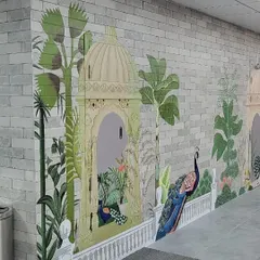 Another view of the tropical Mughal-themed mural in a corporate cafeteria in Hyderabad. The design features lush greenery, elegant gazebos, and a majestic peacock, creating a relaxing and visually rich environment.
