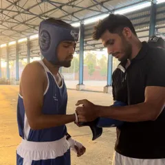 Preparing my fighter for his bout at the 2nd Open National Championships in Panipat. The moments before a fight are just as important as the fight itself.