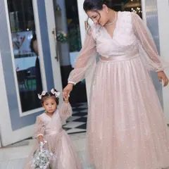 Delicate and dreamy, this matching set in soft pink features sheer, pearl-studded balloon sleeves. It's a beautiful option for a birthday party or a special event.