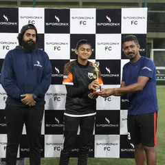 Presenting the trophy to a deserving winner of a corporate football match. We manage all award ceremony logistics, including trophies and backdrops.