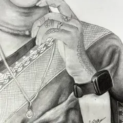 A close-up view of the hand from the previous portrait, showing the detailed line work of the henna design and the texture of the sari fabric.