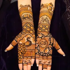 A full bridal design with personalized initials 'GS' and peacock motifs.