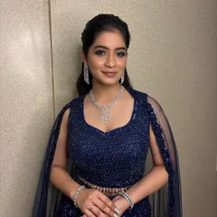 Ready for the Sangeet night. This look is all about glamour with shimmering silver eyeshadow, sharp winged liner, and a radiant complexion, paired with a stunning diamond necklace.