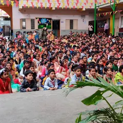 The entire school courtyard is packed with an eager audience. Performing for such a large and enthusiastic group of kids is an incredible feeling.