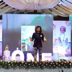 Commanding the stage during a first birthday celebration. My performance is a mix of emceeing and magic, ensuring there's never a dull moment and keeping guests of all ages entertained.