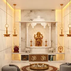 A luxurious pooja room designed with white marble, featuring a traditional arch and hanging brass lamps for a serene and opulent feel.