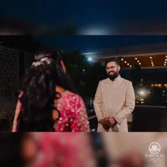 A beautiful 'first look' moment. Our NRI client, dressed in a custom Rajwada sherwani, sees his bride for the first time, a memory made even more special with the perfect attire.