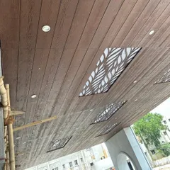 Another angle of the wood-clad ceiling, showing the intricate leaf pattern of the backlit panels. We can create custom designs to spoil you with endless options.