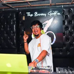Behind the console at The Boozy Griffin, getting the party started. This is a typical Friday night for me, setting the vibe with a mix of commercial and Bollywood tracks.