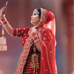 This candid photo of the bride taking a selfie shows how confident and happy she feels. My makeup is designed to be photogenic from every angle, even on your phone camera.