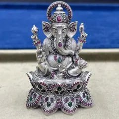 A detailed view of our stone-adorned Lord Ganesh murti. The fine work on the trunk, ears, and the modak in his hand reflects our commitment to quality and authenticity in our religious artefacts.
