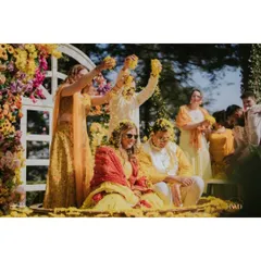 The moment of pure joy as the couple is showered with marigold petals by their loved ones. We design our Haldi setups to be interactive and full of energy.