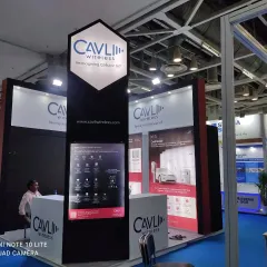 The stall I designed and fabricated for Cavli Wireless. The tall, branded pillar acts as a landmark, making the booth visible from a distance.