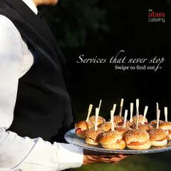 Our staff serving mini burgers at an outdoor event. We cater to high-teas, corporate gatherings, and launch events with a wide range of bite-sized snacks and appetizers.