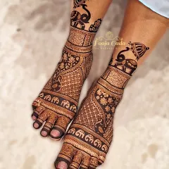 A bold and beautiful feet design featuring a parade of elephants and intricate jaal work, perfect for a royal bridal look.