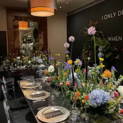 The full view of the elegant long table, where modern design meets natural beauty. We work with top decorators to ensure the ambiance is as exquisite as the food.