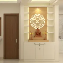 A modern and minimalist pooja unit design. The backlit 'Om' mandala and the clean white cabinet with shelves for idols create a serene and sacred space.