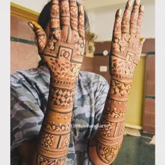 Another view of the beautiful engagement mehendi, showing the full design on both arms.