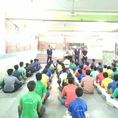 Our instructors addressing a large group of students at a self-defense workshop held at a local school. We believe these essential life skills should be accessible to everyone.
