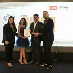 Another proud moment on stage, accepting an award for our academy's achievements.