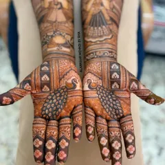 The full view of both hands, showing how the individual portraits and motifs come together to create a cohesive and grand bridal statement.