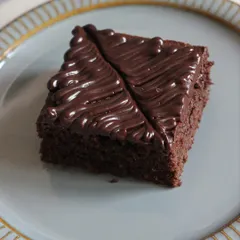 A slice of our rich, cakey brownie with a glossy chocolate frosting. Our class covers both fudgy and cakey brownie types to suit all preferences.