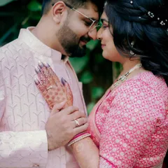 A tender moment from an engagement shoot, with the couple touching foreheads. The bride's hand on his chest shows their deep connection.