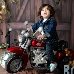 Meet the little rockstar! This fun and imaginative toddler photoshoot shows off your child's budding personality with a cool motorcycle prop and a denim-on-denim look, creating portraits that are as unique as they are.