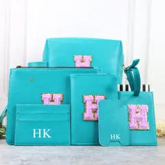 Here is the Monogram Travel Combo in a vibrant turquoise. This matching set of personalized travel essentials is perfect for adding a pop of color and personality to your journey, ensuring you travel in style.