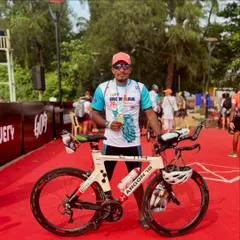 One of our swimmers proudly posing with his bike and finisher medal after the Ironman Goa 70.3. We provide the swim training and confidence needed to take on these incredible endurance challenges.