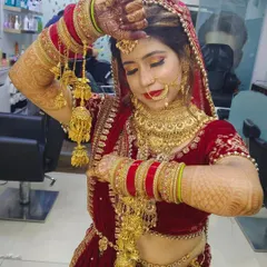 This bride is ready for her big moment, showcasing her beautiful kalire. I created a traditional bridal look with warm, golden eyes and a classic red lip to match her stunning velvet lehenga.