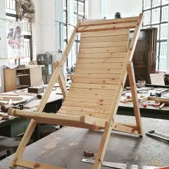 A student in our diploma program designed and built this solid wood lounge chair. The project involved creating strong, angled joints and assembling numerous slats to create an ergonomic and stylish piece of outdoor furniture.