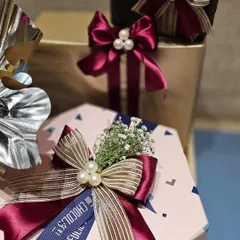 A close-up of the bow details from the Shoppers Stop and Axis Bank hampers. I layered different ribbons and added pearl accents to create a look that is both corporate and chic. The custom branded ribbon adds another layer of personalization.