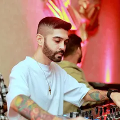 A close-up shot of me working the mixer. Every knob and fader is used to blend songs seamlessly and build energy on the dance floor.