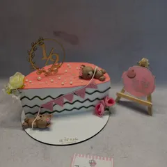 Celebrating the six-month milestone with a half-birthday cake. This heart-shaped cake is decorated with cute sleeping teddy bears and a "1/2" topper.