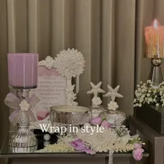 An elegant hamper in shades of lavender and white. This set includes a personalized photo frame, candle holders, and beautifully decorated jars, perfect for a birthday or anniversary.