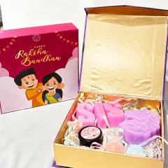 Here is one of our beautiful Raksha Bandhan hampers, designed to make your sister feel truly special. This gift box includes personalized 'SIS' letter soaps, a unicorn soap, mini bath bombs, and an organic lip balm, all packed in a festive magnet box.