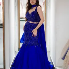 All eyes on the curves and the color. This royal blue mermaid lehenga speaks loud and clear, making a bold statement.