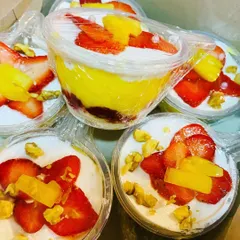 My delicious fruit trifle cups are made with moist cake, homemade strawberry jam, creamy custard, and fresh fruit, all topped with more fruit and nuts.